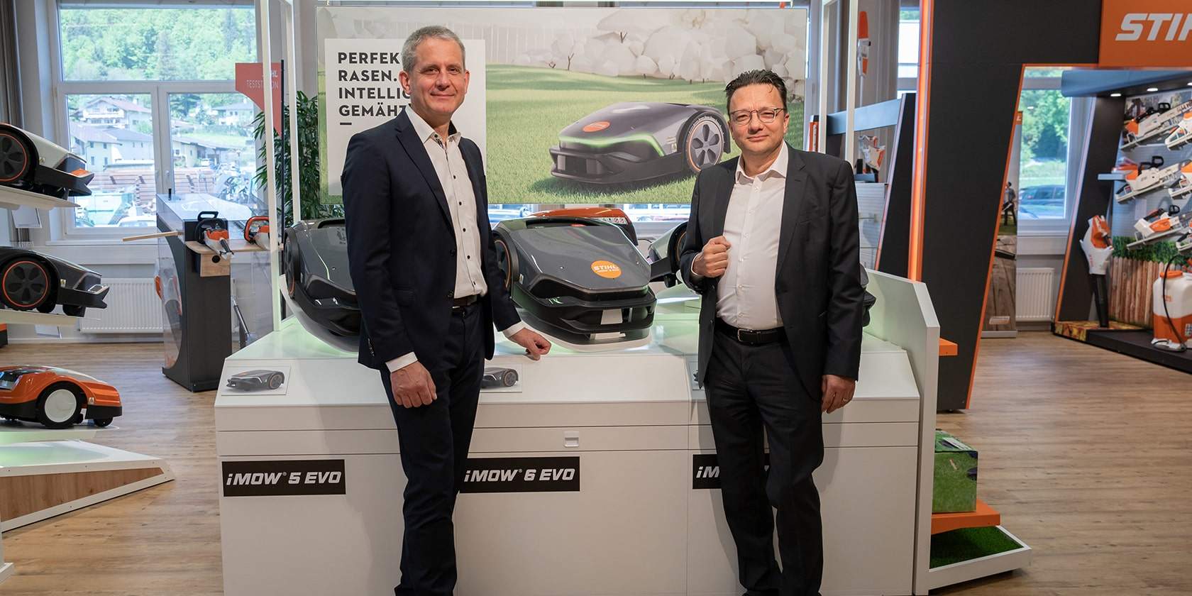 Thilo Foersch (Commercial Manager at STIHL Tirol) and Jan Grigor Schubert (Managing Director of STIHL Tirol) in front of the new generation of iMOW robotic mowers, which were launched in spring 2023.